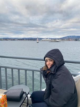 Nicole sitting next to the water